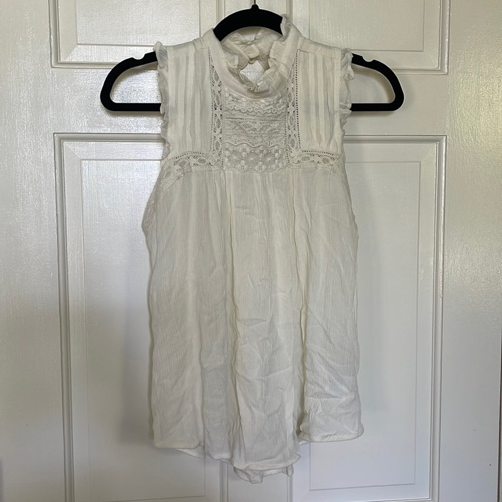 Anthropologie ivory sleeveless top.